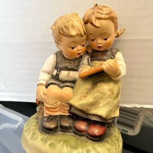 Goebel Ceramic Figurine of a big sister  reading to her brother.